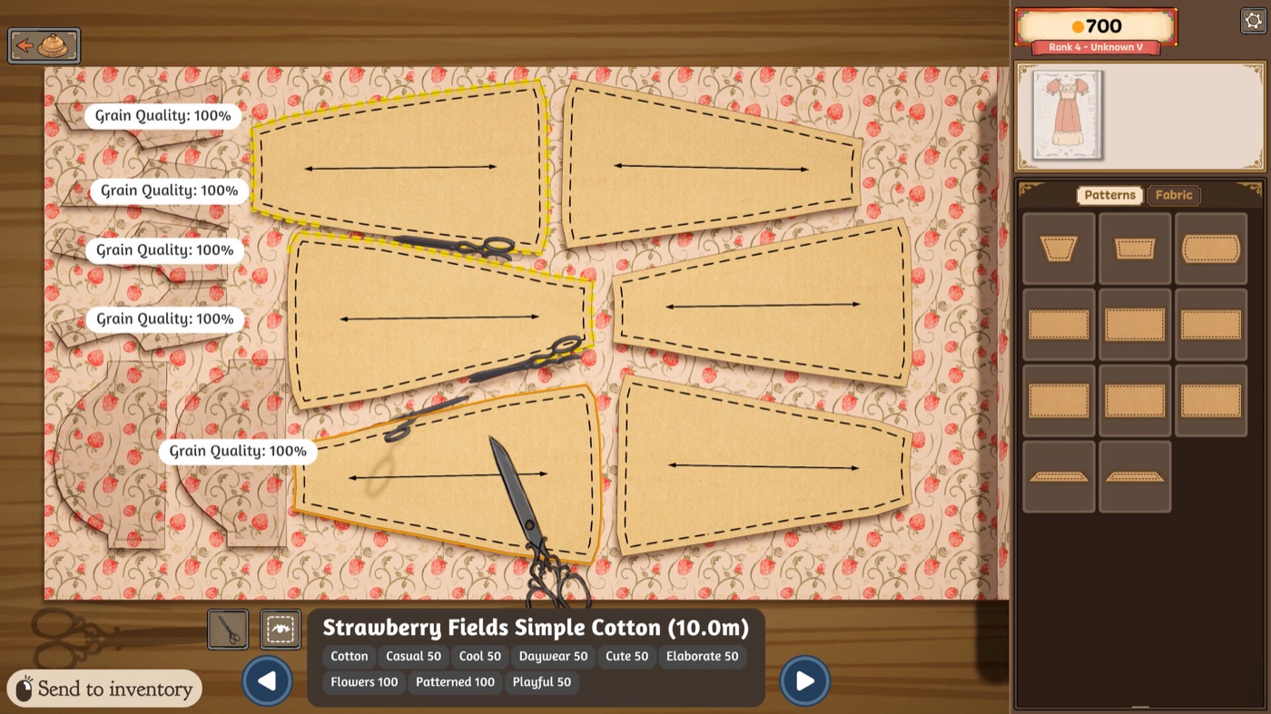 Several pattern pieces arranged on a printed cotton roll on the cutting table, each displaying a grain quality readout while scissors cut along the marked outline